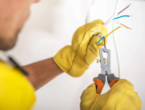 Electrician installing a new data point for network and communications cabling