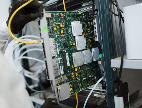 Picture of technician repairing cmts networking cards ASP accredited electrician performing switchboard upgrade Newcastle
