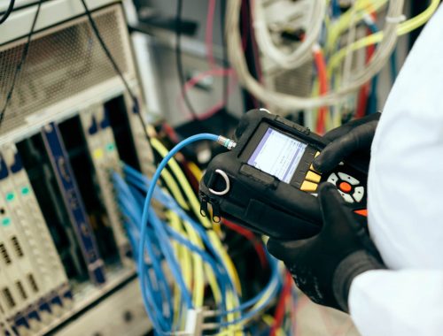 Technician repairing cmts cards Electrical mains maintenance services Newcastle. Powellect